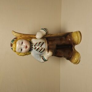 Vintage ceramic unmarked girl figurine with skis